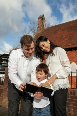 medium-shot-smiley-parents-kid-with-bible-23-2149344051.jpg